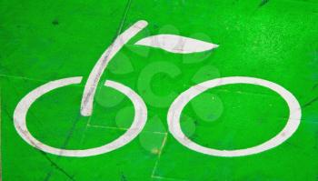 Green asphalt sign of bicycle