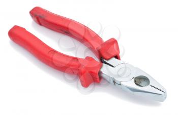 Red pliers on the white
