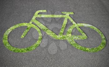 Grass bicycle sign on the road
