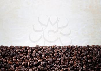 Coffee beans on paper background