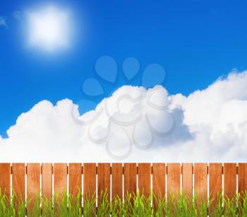 Fence over white cloud and sunny sky