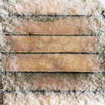 Wooden board background with snow
