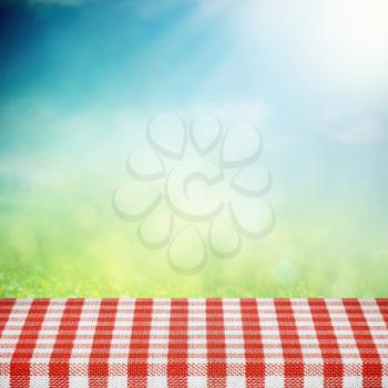 Picnic table on the summer field in sunlight