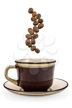 A cup of brown glass with coffee and steam coffee beans isolated on white background