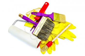 Brushes of various sizes with yellow gloves and roller isolated on white background