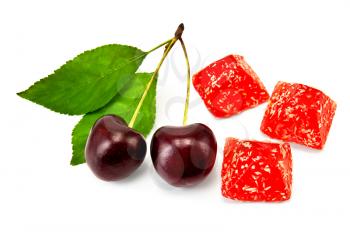 Three red jelly with two cherries and green leaves isolated on white background