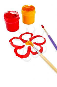 Flower, painted red and yellow paint, two brushes and two cans of red and yellow gouache isolated on white background