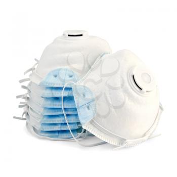 A stack of white with blue detail disposable respirators isolated on white background
