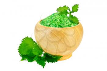Green bath salt in a wooden bowl with nettle isolated on white background