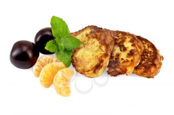 Three golden fried toast, two plums, three slices of mandarin, mint sprig isolated on white background