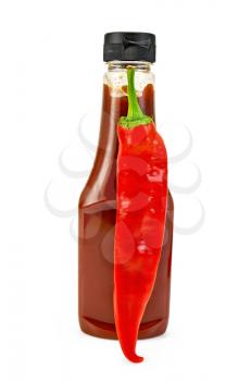 Tomato ketchup in a plastic bottle, pod hot pepper isolated on white background
