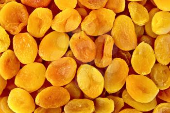 The texture of orange and yellow dried apricots