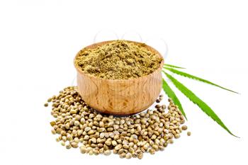 Hemp flour in a bowl, beans and green leaf of hemp isolated on white background