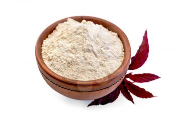 Amaranth flour in a clay bowl and purple amaranth flower isolated on white background