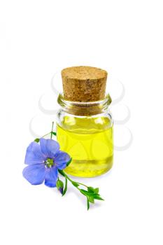 Linseed oil in a glass bottle with blue flax flower isolated on white background