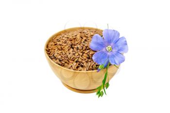 Brown flaxseeds in wooden bowl with blue flower isolated on white background