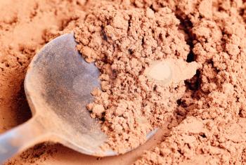 Royalty Free Photo of a Spoon in Cocoa