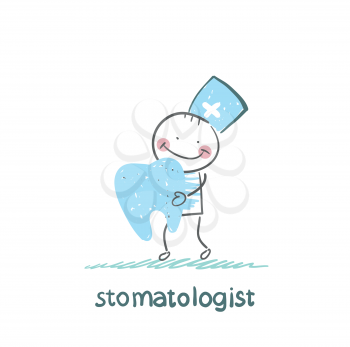 stomatologist holding a tooth