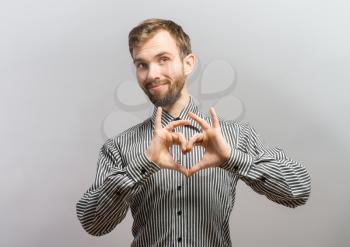 Asian young forming a heart shape 