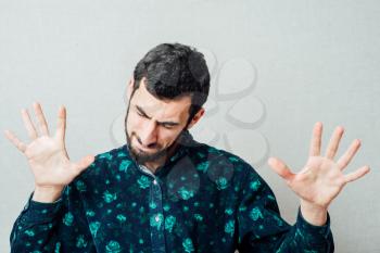 young angry man gesturing - no, with hands and saying no