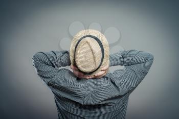 Male tourist with hat , rear view, back 