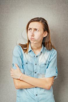 Nice young girl with emotion of offence on her face