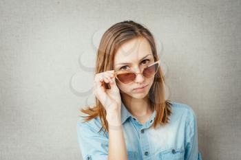 pretty girl corrects glasses