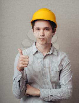 young man in a construction helmet