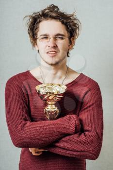 man in glasses with a cup winner