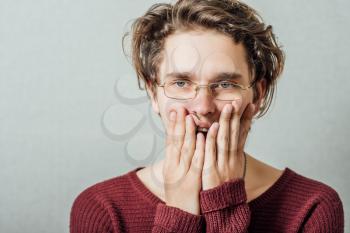 Young businessman holding head in his hands