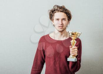 Happy man with a golden cup