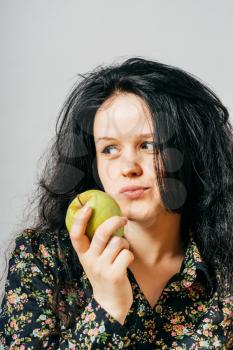 girl holding an apple