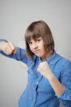 young woman in fighting stance