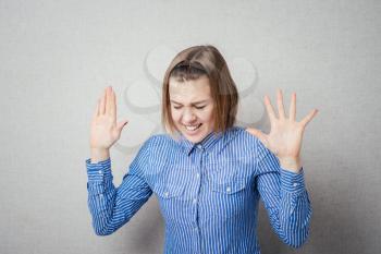 Lady making stop gesture with her palm, isolated 