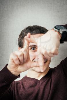 man showing thumbs frame