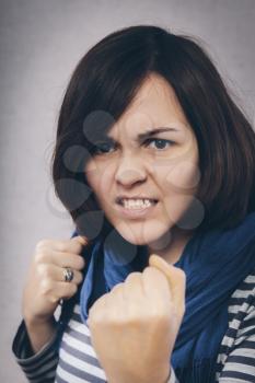 Young woman showing fists