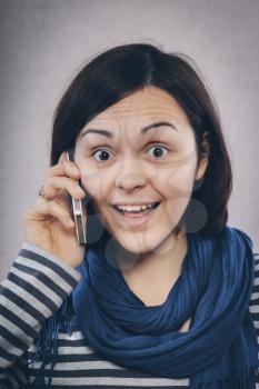 young girl speaks by mobile phone