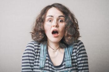 A beautiful young surprised woman
