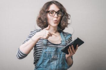 young woman shows tablet