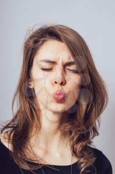 woman show kiss lips, face portrait of business woman. funny face