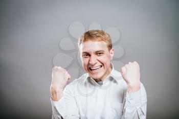 Portrait Of  Smiling Man With The Fists Up