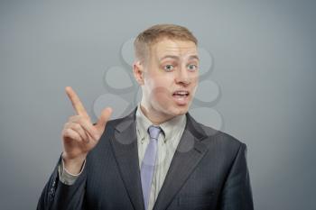 business man pointing up finger isolated 