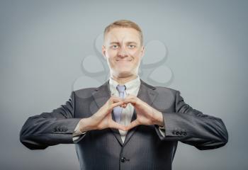 Happy businessman with love gesture