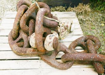 rusted chains at a boatyard. 