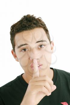 young man with finger on his mouth isolated over white background