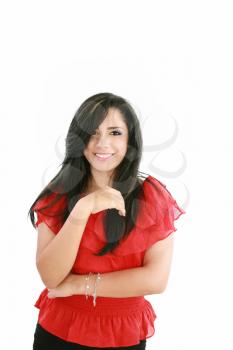 Portrait of a happy young business woman standing with folded hand against white background 
