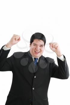 Young attractive happy smile business man stand and expressing success and victory concept, holding raised arms and hands up, isolated over white background