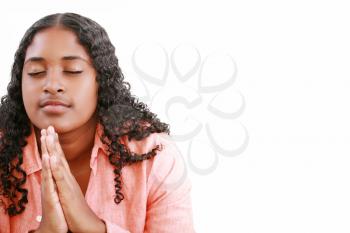 woman praying isolated on a white background.