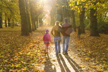 Royalty Free Photo of a Family Walking Through a Park