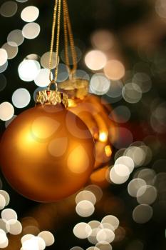 Christmas golden ball with a light blur creating bokeh in the background